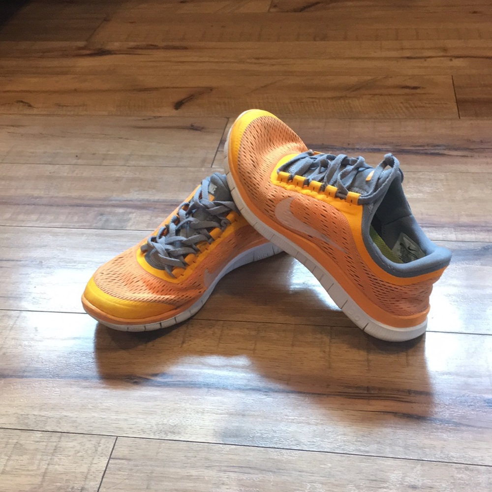 Nike orange running shoe